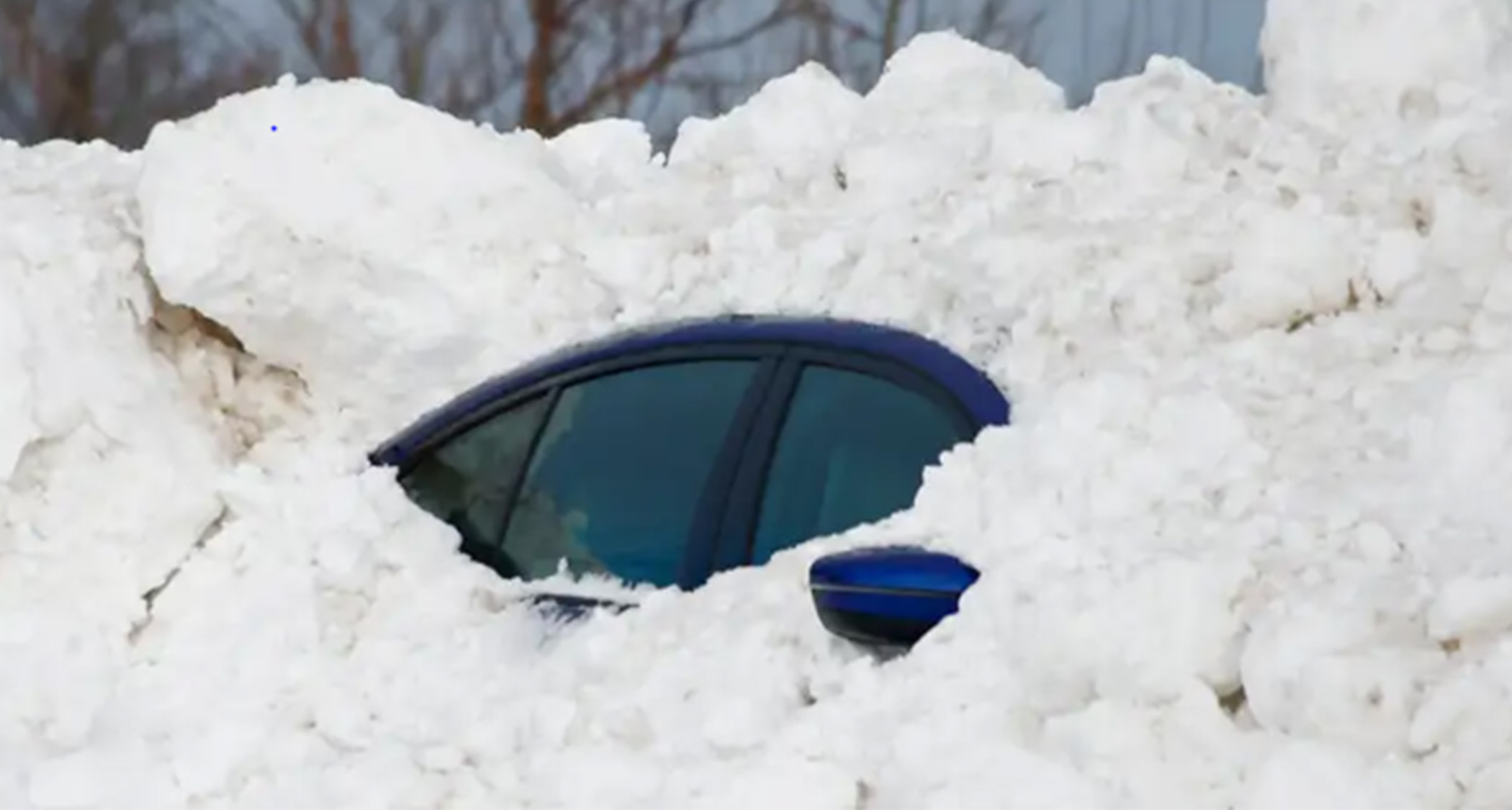 Car Covered in Lake Effect Snow Blizzard