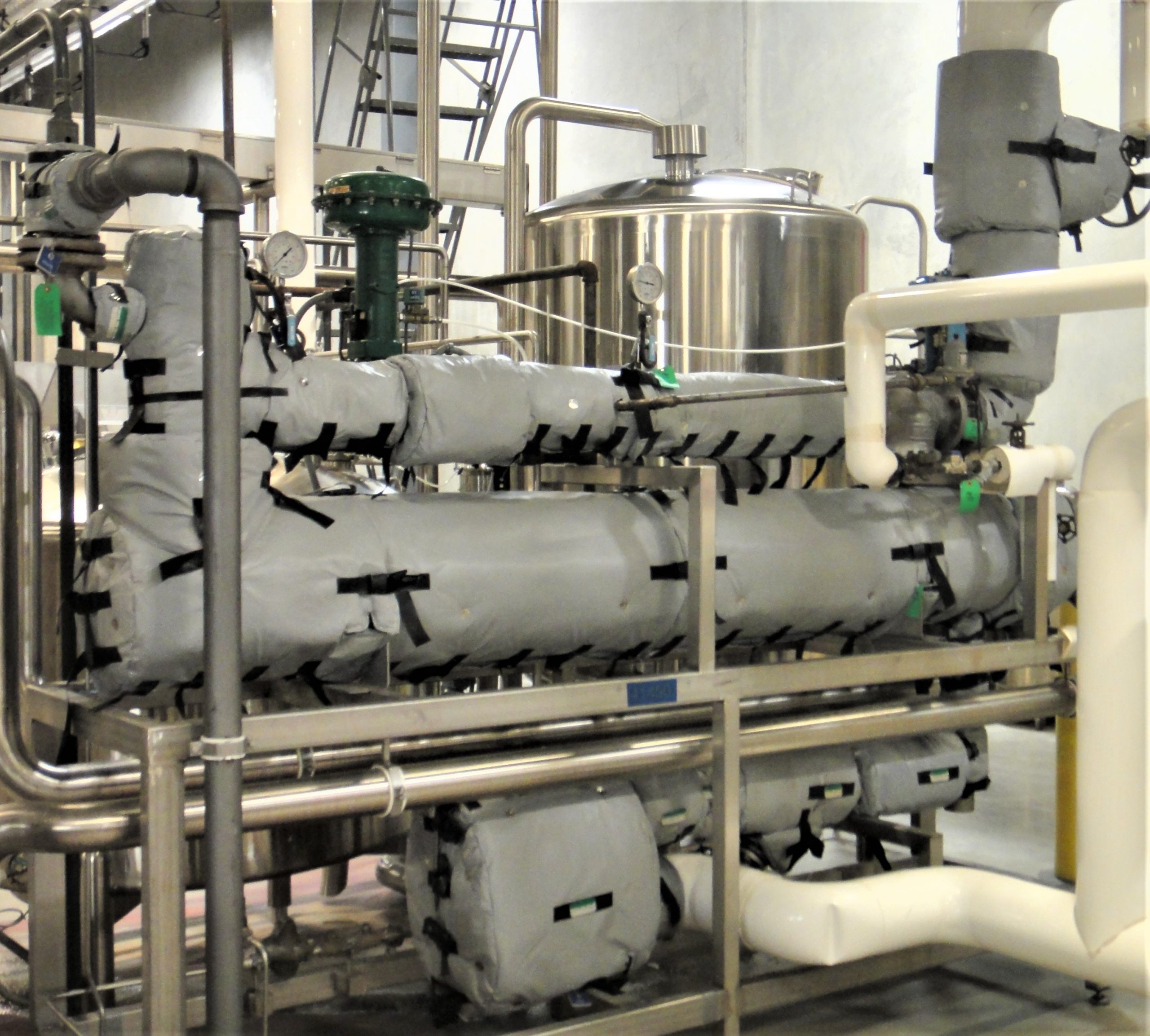 Shell Tube Pasteurizer in food processing facility with Shannon thermal insulation blankets