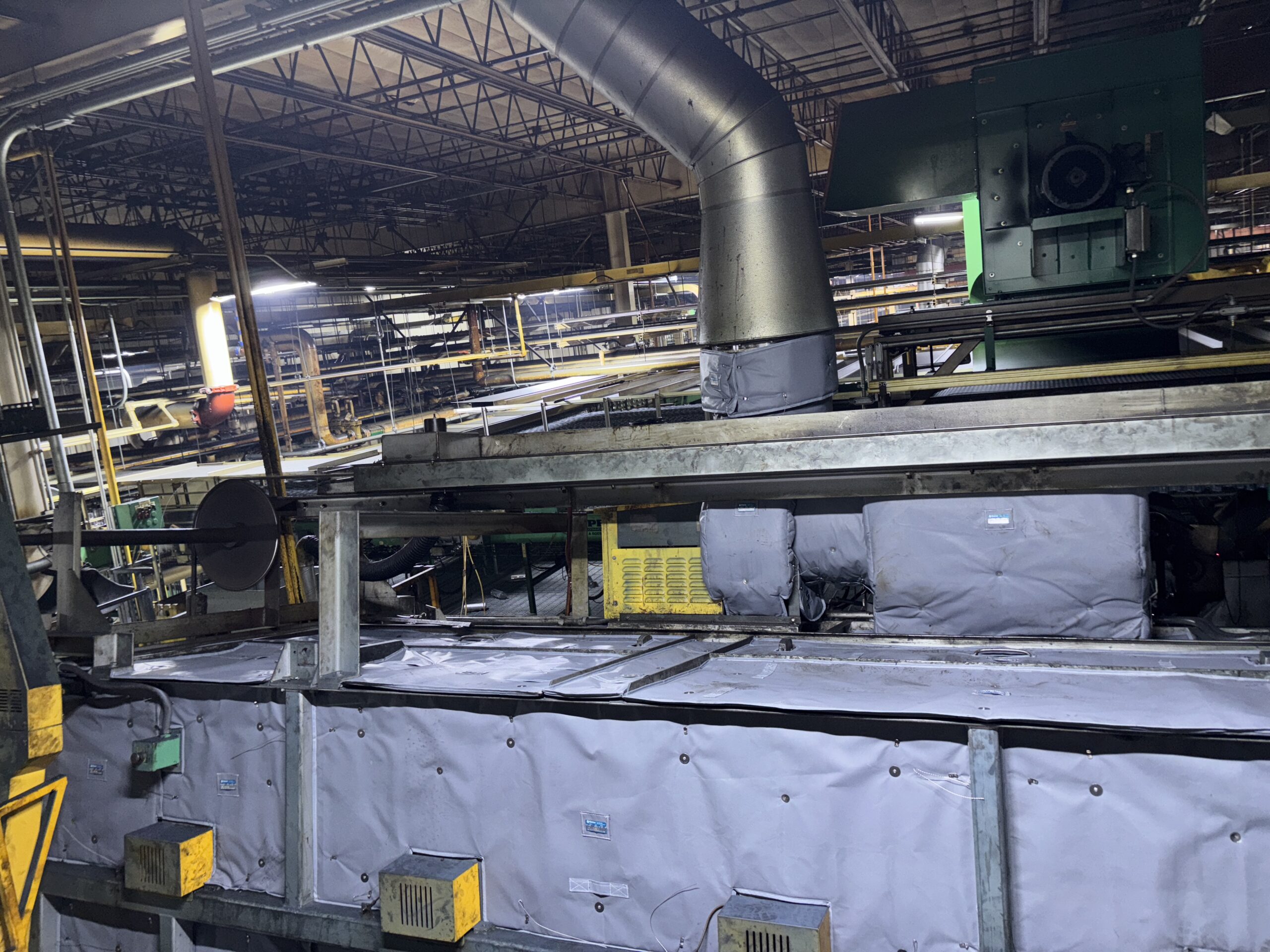 Project Highlight- Beverage Can Manufacturing - Pin Oven showing Shannon's expert fit around the complicated geometry of protruding elements. Shannon Global Energy Removable reusable Insulation Blankets are best for Processing equipment in Food & Beverage industry.