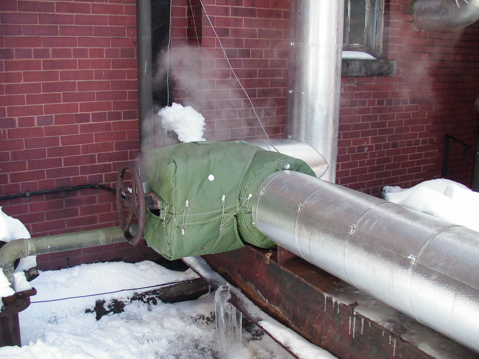 Shannon Insulation Blanket on Shut-off valve in cold, snow.